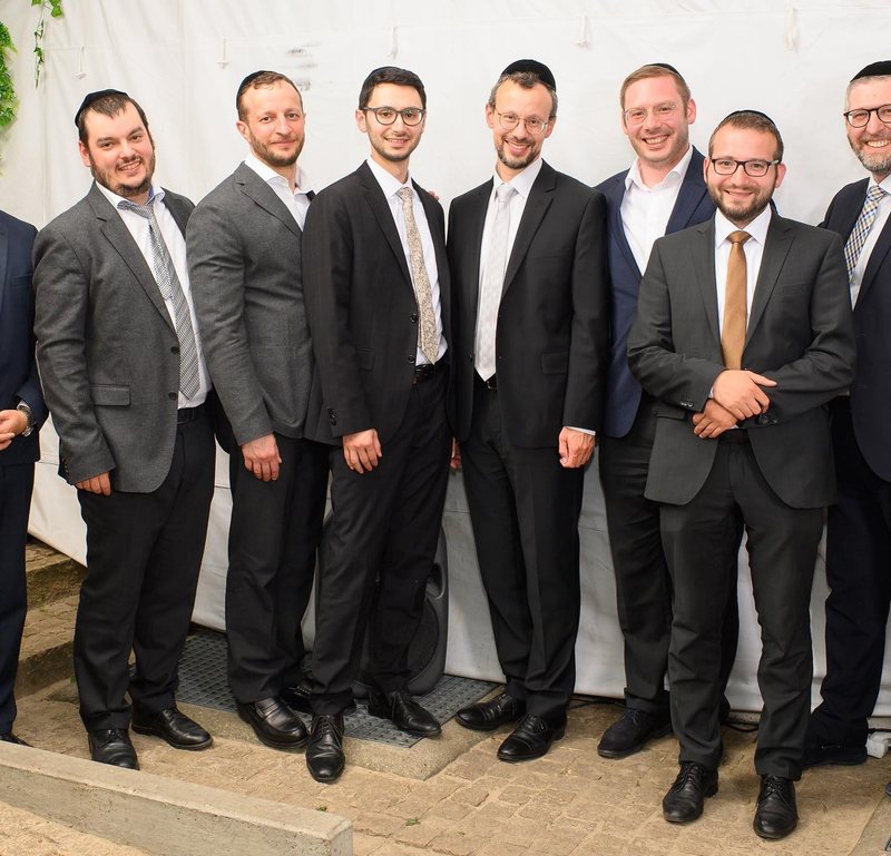 Rabbi Moshe Halpern with talmidim and colleagues